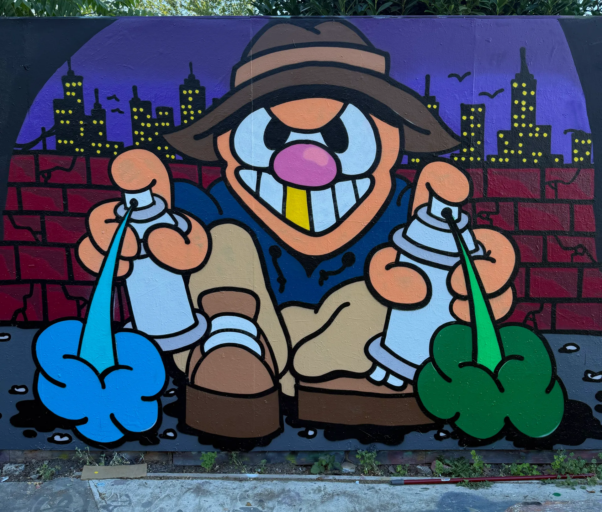 Wall mural, hooded character with two spray cans