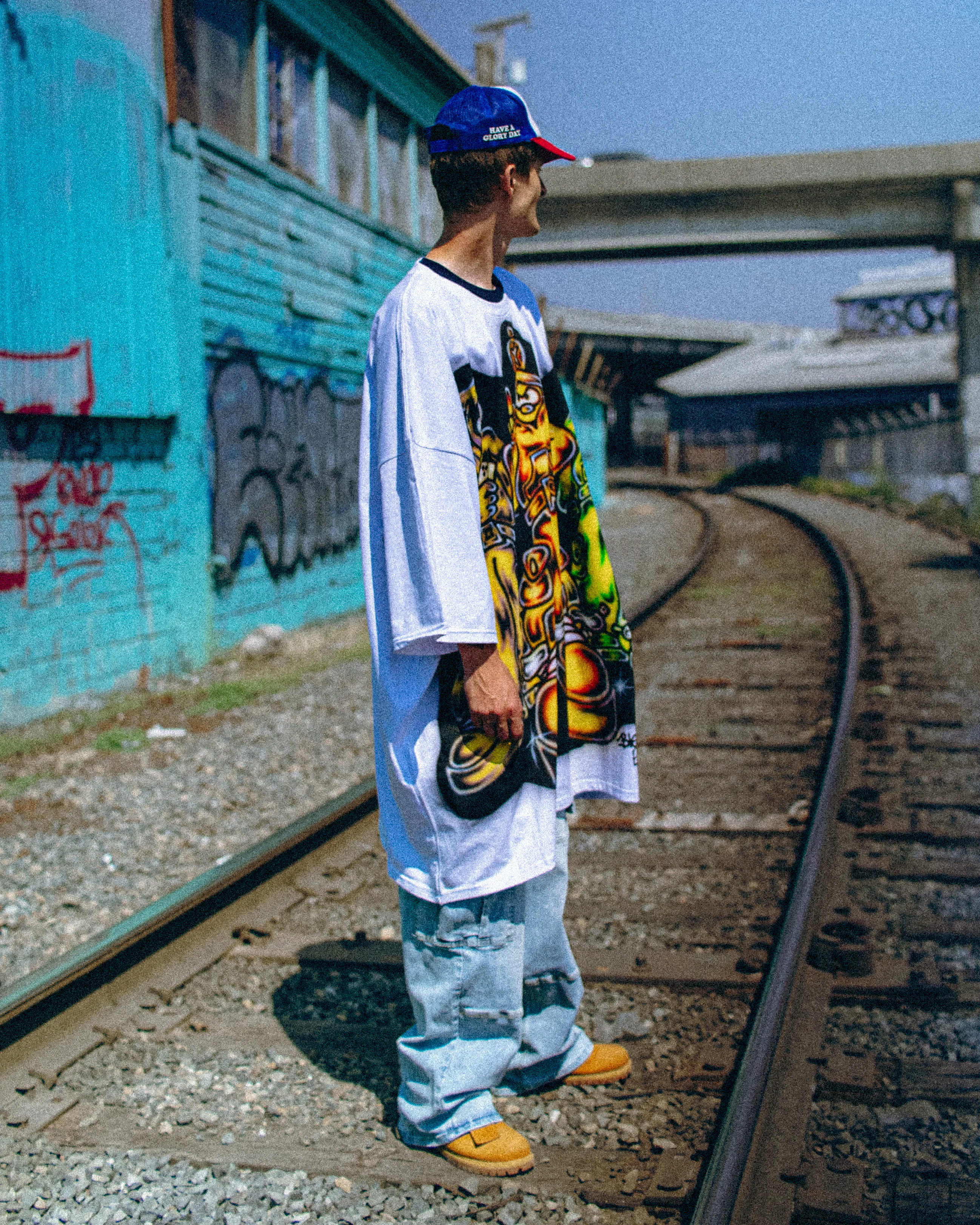 The airbrushed tee worn on train tracks